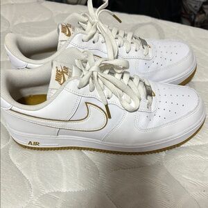 Nike Air Force 1 White and Gold Sneakers